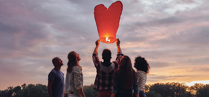 group of people flying sky lantern